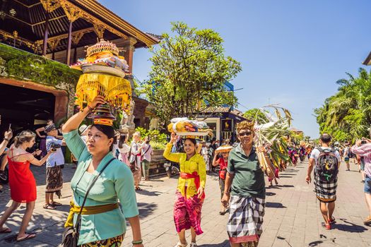 Ubud, Bali, Indonesia - April 22, 2019 : Royal cremation ceremony prepation. Balinese hindus religion procession. Bade and Lembu Black Bull symbol of transportation for the spirit to the heaven.