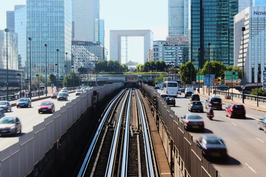 Paris, France - August 26, 2019: Day multi-lane road with skyscrapers of the La Defense.