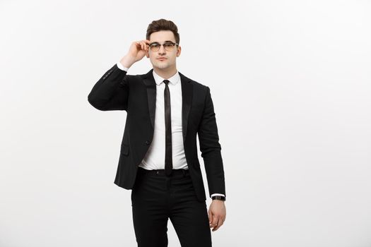 Business Concept: Portrait handsome young businessman wearing glasses isolated over white background.