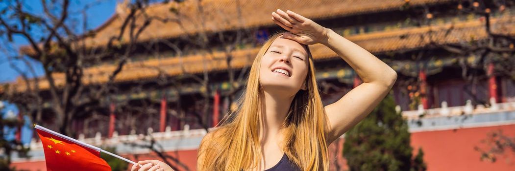 Enjoying vacation in China. Young woman with national chinese flag in Forbidden City. Travel to China concept. Visa free transit 72 hours, 144 hours in China. BANNER, LONG FORMAT