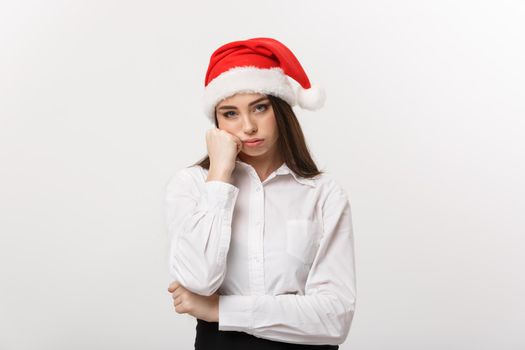 Business Concept - Modern caucasian business woman in christmas theme with serious thoughtful pose.