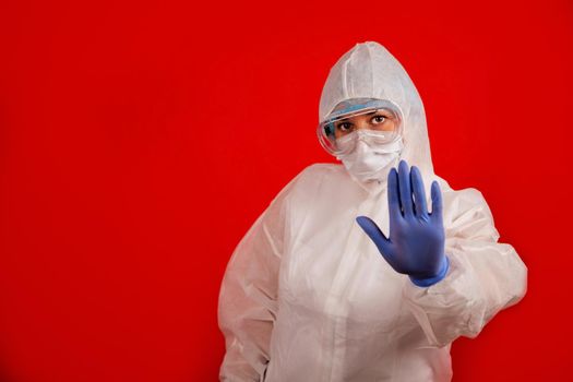 A doctor indicates stopping the spread of the COVID-19 virus. The concept of preventing the spread of the epidemic and treating coronavirus. Coronavirus treatment.