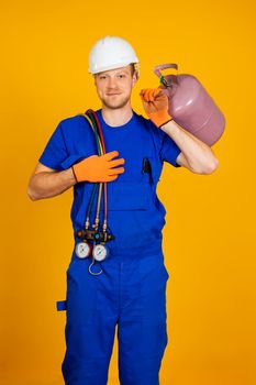 Air conditioning technician. air conditioning repair and pressure gauges, measuring equipment for filling air conditioners.
