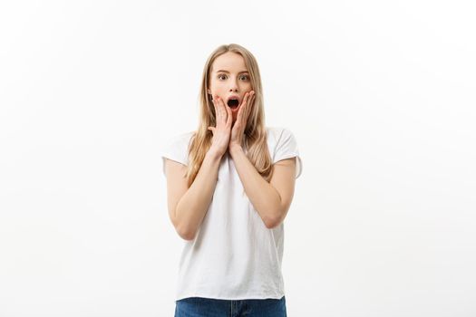 Lifestyle Concept: Portrait of a scared frightened girl standing and surprising facial expression isolated over white background