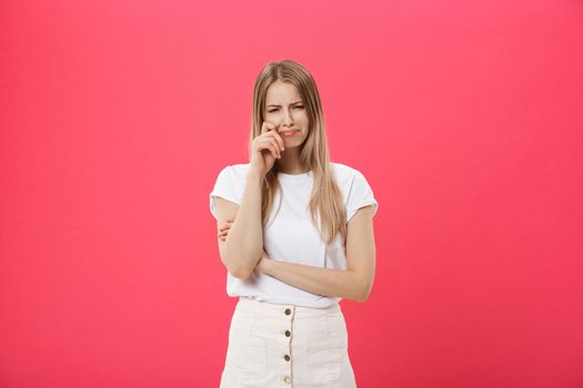 Young caucasian woman over isolated background depressed and worry for distress, crying angry and afraid. Sad expression.