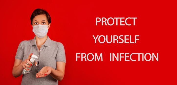 A woman uses a gel, disinfectant, antiseptic. Hand sanitizer prevents viral and plague infections, prevents the appearance of the Kovid-19 virus.