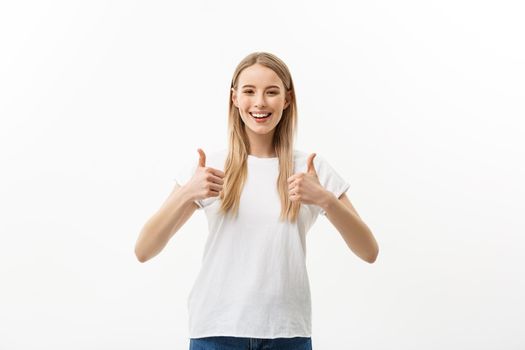 Concept of success happy student. Portrait of attractive smile teenage girl show thumbs up gesture, in white shirt, isolated over white background