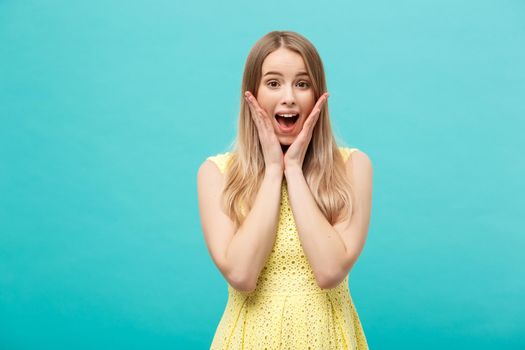 Close up Portrait young beautiful attractive girl shocking with something. Blue Pastel Background. Copy space