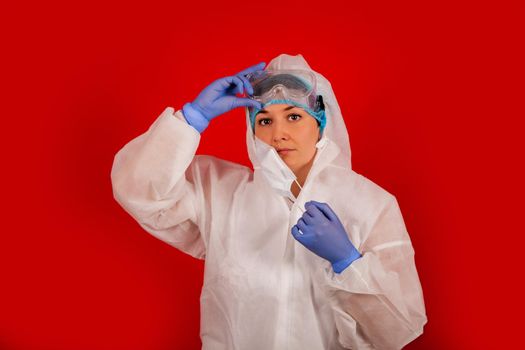 Doctor woman in a protective suit against coronavirus. Medical staff, preventive equipment. Doctor woman in a protective suit against coronavirus. Medical staff, preventive equipment