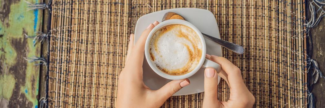 Young woman drinks coffee in a cafe in the mountains. BANNER, LONG FORMAT