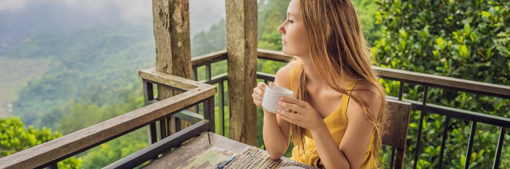 Young woman drinks coffee in a cafe in the mountains. BANNER, LONG FORMAT