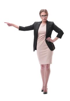 full length . strict businesswoman pointing to the side. isolated on grey background