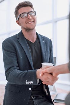 close up. business people greeting each other with a handshake