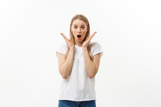 Lifestyle Concept: Portrait of a scared frightened girl standing and surprising facial expression isolated over white background