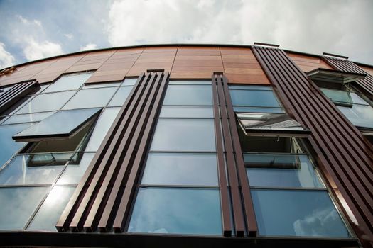 Glass building with open windows.