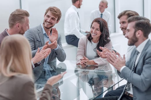 confident business woman explaining something to her business partners . business concept