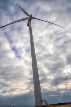 A wind turbine. The windmill for electric power production. Green energy. 