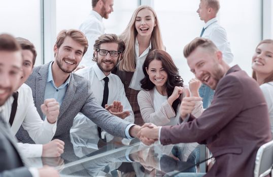 happy business people shaking hands in the conference room . photo with copy space