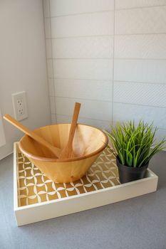 Empty wooden salad bowl on the kitchen table. Interio decoration