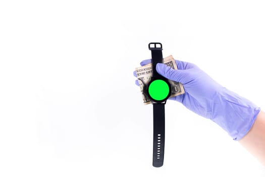 Green screen Smart watch on hand in rubber glove holding money with white background. Space for text