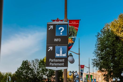 Signs of directions to Info Centre and Parliament Hill seen in downtown Ottawa.