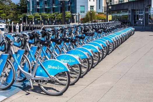Vancouver, BC Canada - Septembre 2, 2020: A row of bicycles at Mobi bike-share station.