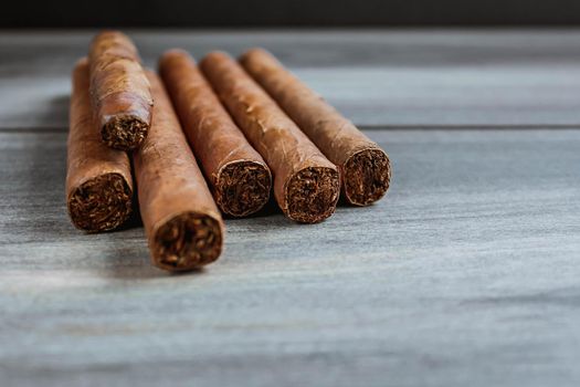 Cigars on the wooden background