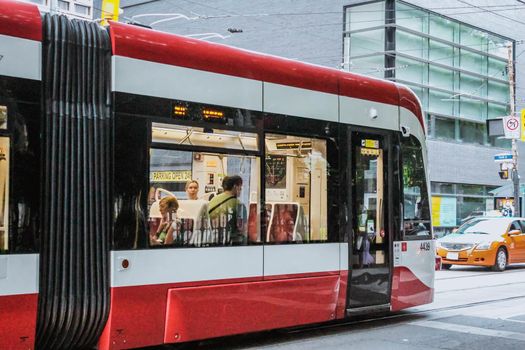 TORONTO, ONTARIO Canada- August 29, 2019: TTC Close view os a streetcar in downtown Toronto's entertainment district. New tram on streets of Toronto