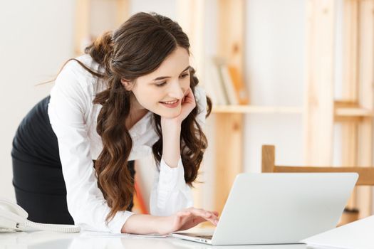 Work from home concept - Beautiful young woman in her home working on laptop. Working at home. Quarantine