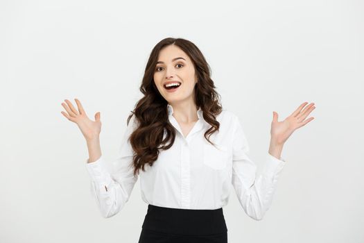 Business woman happy and surprise showing product .Beautiful girl holding hand to the side.