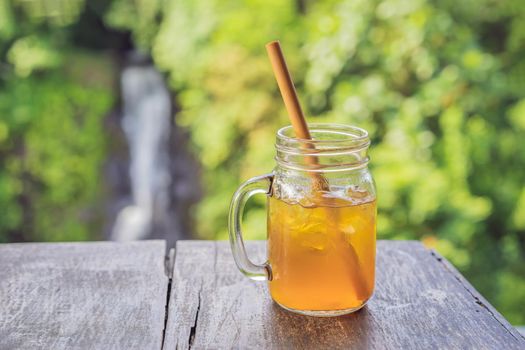 Iced tea on the background of waterfalls.