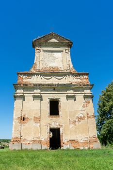 The facade of an ancient destroyed Christian temple. Ukraine.