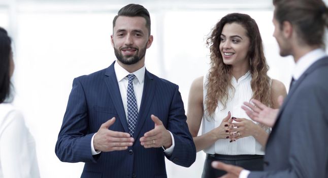 closeup.business people argue standing in office