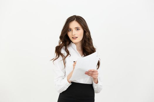 Business Concept: beautiful business woman write on paper or report. Isolated over white background