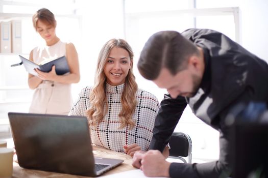 young business woman sitting at office Desk. people and technology