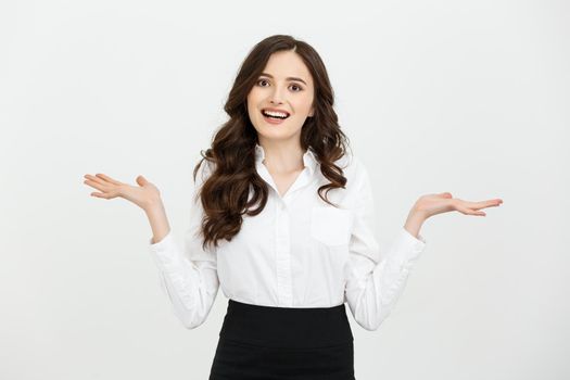 Business woman happy and surprise showing product .Beautiful girl holding hand to the side.