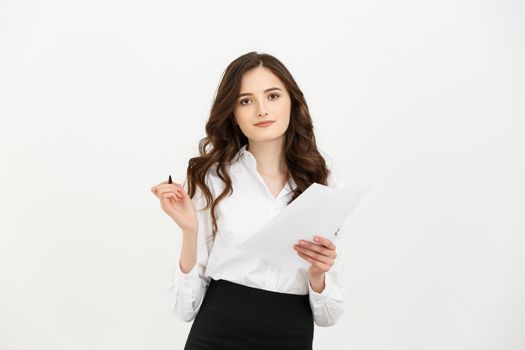 Business Concept: beautiful business woman write on paper or report. Isolated over white background