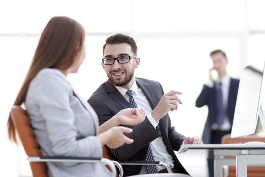 business colleagues talking at their Desk .office life