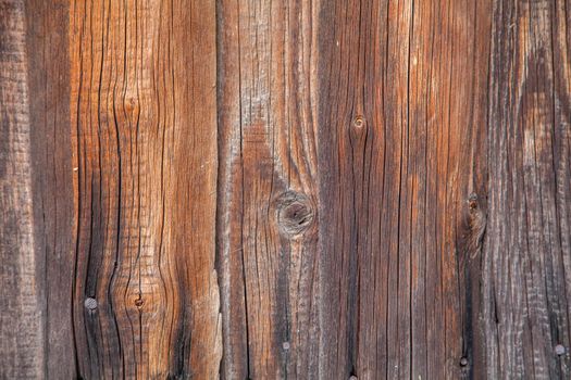 Texture of an old wooden board in brown color.