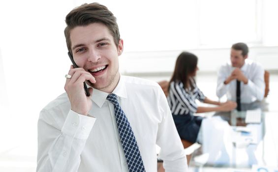 closeup.businessman talking on a mobile phone.photo with copy space