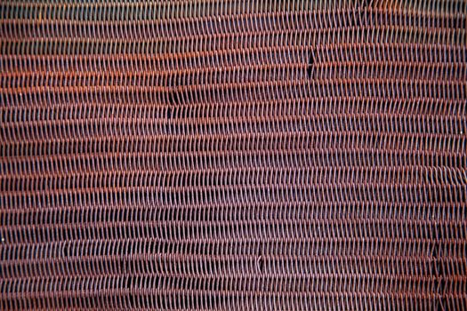 Texture of an old rusty metal mesh.
