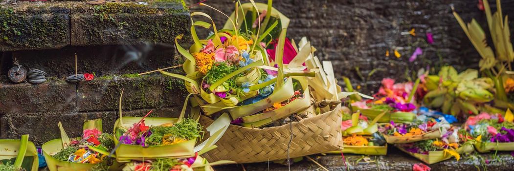 Daily offerings - canang sari is very important in Bali, Indonesia. BANNER, LONG FORMAT