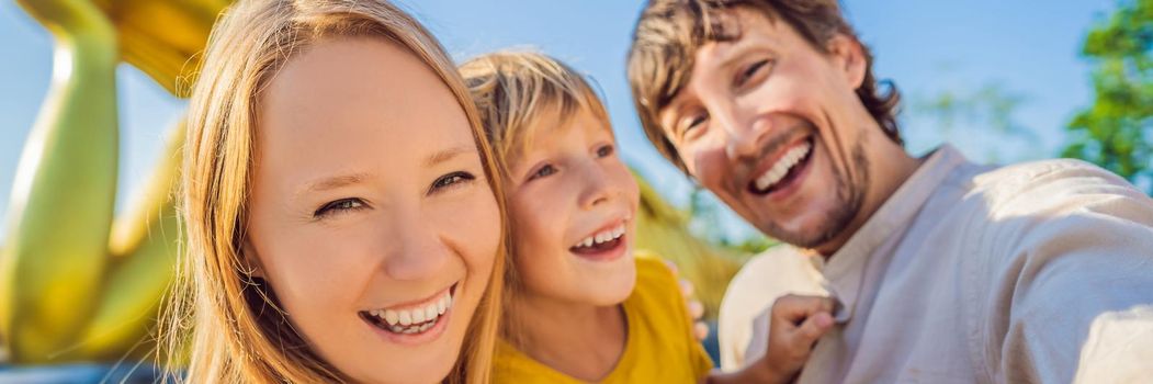 Happy tourists mother, father and son on background ofLying Buddha statue. BANNER, LONG FORMAT