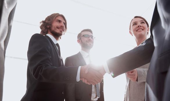 business team and the final handshake of business partners