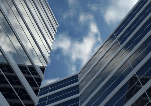 Blue skyscraper. Glass mirror of the facade of buildings. 3D render of a skyscraper, modern architecture.