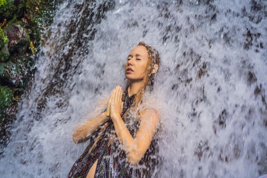 Young woman tourist in Holy springs Sebatu in Bali.