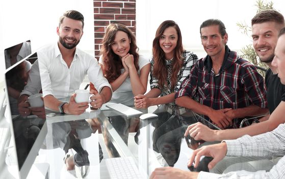 portrait of a young business team sitting at Desk