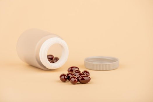 A bottle of tablets or capsules with krill oil is a dietary supplement rich in omega-3. Powerful antioxidants.