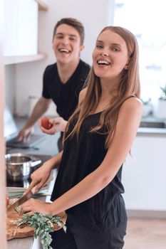 close up. happy young couple cooking dinner together