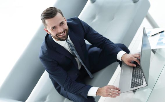 businessman working on laptop in office. Concept of technology